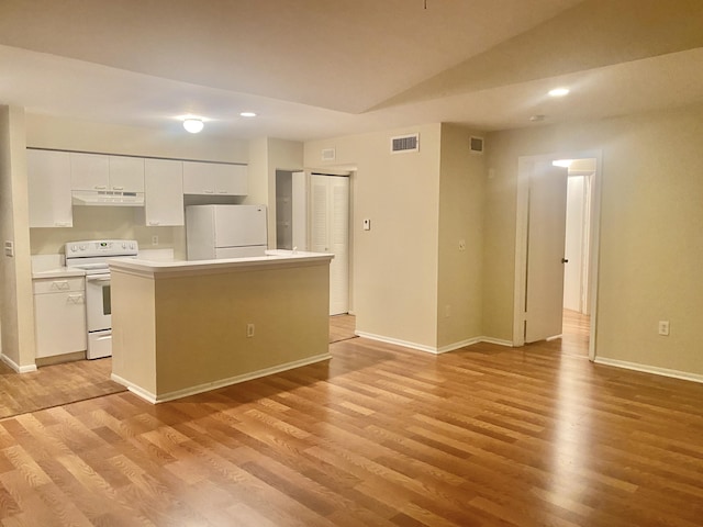 kitchen with light hardwood / wood-style flooring, white cabinets, white appliances, and a kitchen island