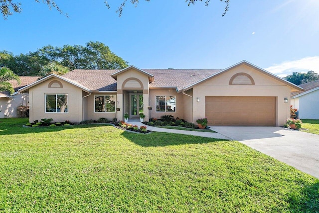 single story home with a front yard and a garage