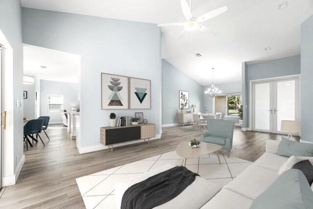 living room with hardwood / wood-style flooring, high vaulted ceiling, and ceiling fan