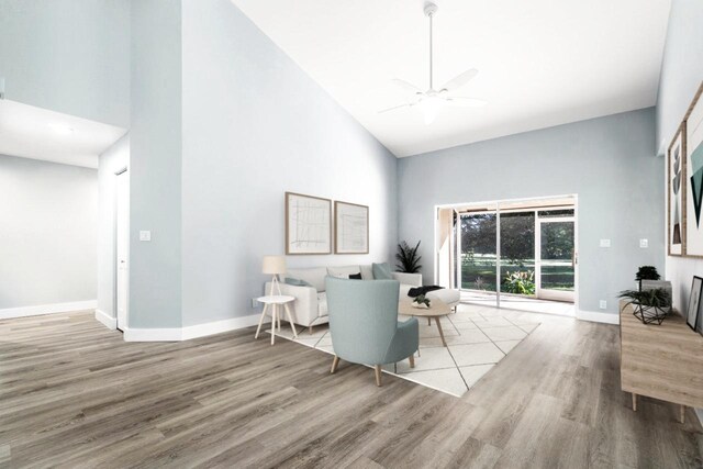 kitchen featuring pendant lighting, white cabinets, light hardwood / wood-style flooring, appliances with stainless steel finishes, and kitchen peninsula