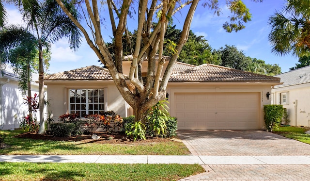 mediterranean / spanish-style house featuring a garage