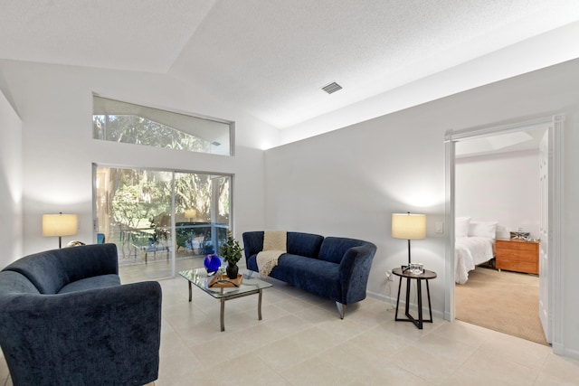 living room with light carpet and vaulted ceiling