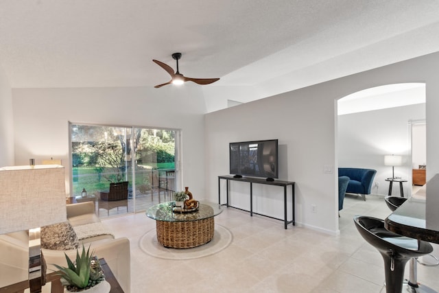 living room featuring high vaulted ceiling and ceiling fan