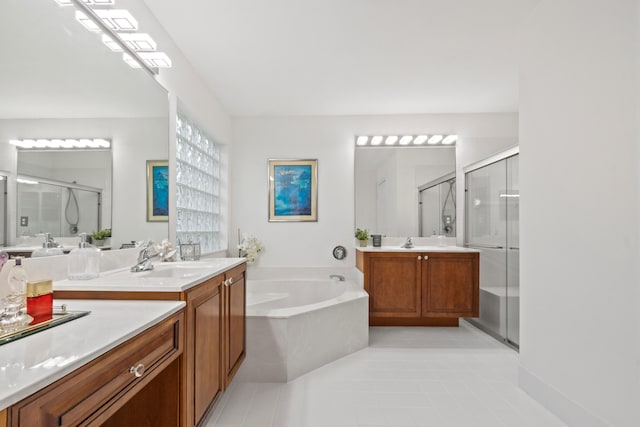 bathroom with tile patterned floors, vanity, and plus walk in shower