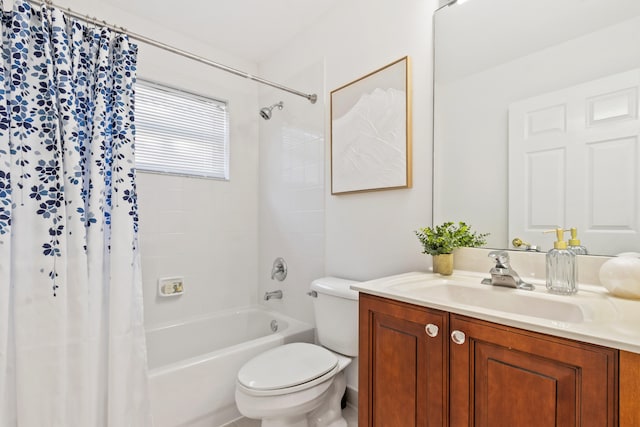 full bathroom with shower / bath combo with shower curtain, vanity, and toilet