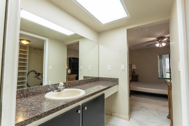 bathroom featuring vanity and ceiling fan