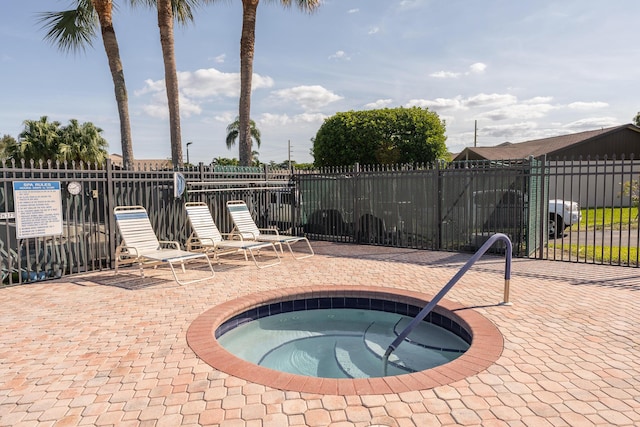 view of pool with a community hot tub