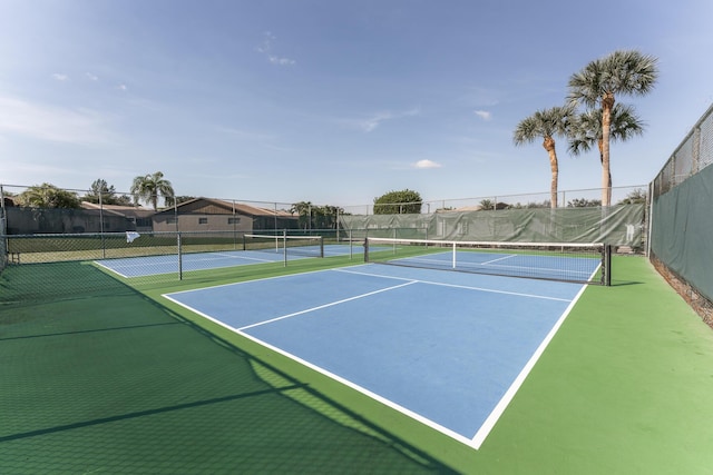 view of sport court with basketball hoop