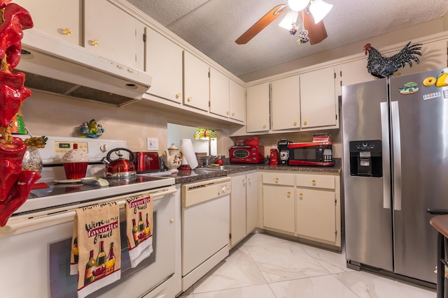 kitchen with a textured ceiling, ceiling fan, sink, and white appliances