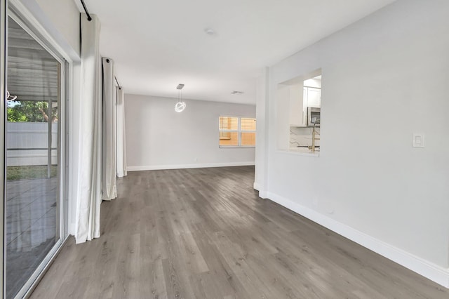 spare room featuring light wood-type flooring