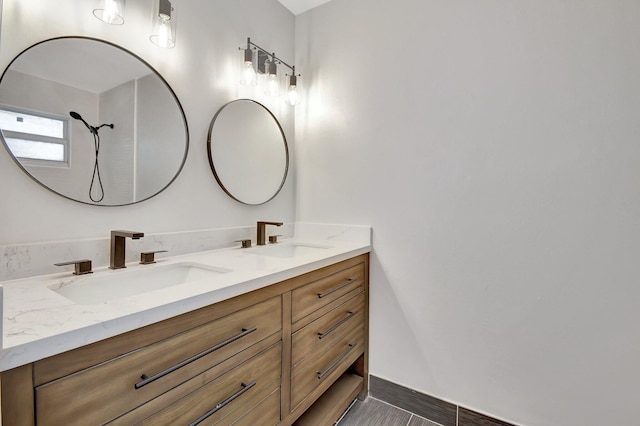 bathroom featuring tile patterned flooring and vanity