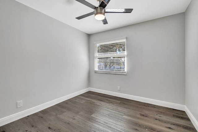 unfurnished room featuring ceiling fan and dark hardwood / wood-style flooring