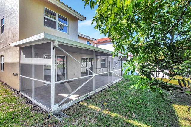 exterior space featuring a sunroom