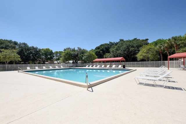 view of swimming pool with a patio area