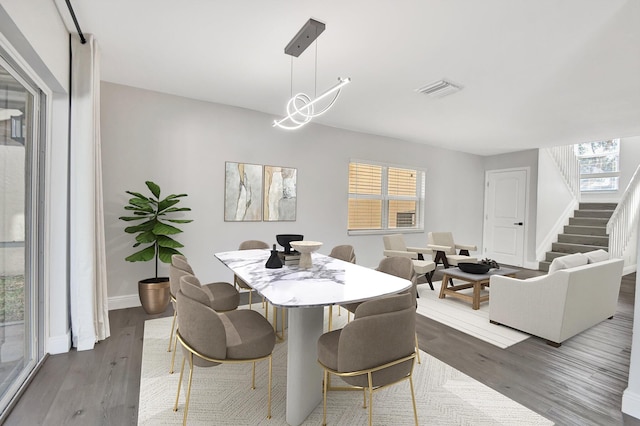 dining area featuring dark hardwood / wood-style floors