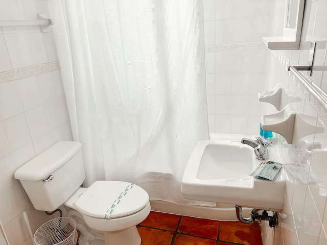 full bathroom featuring tile patterned floors, sink, tile walls, and toilet