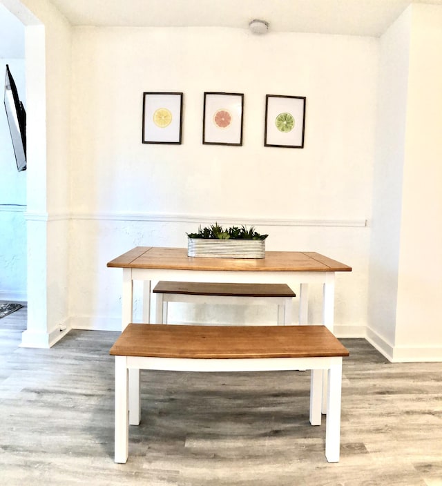 unfurnished dining area featuring hardwood / wood-style floors