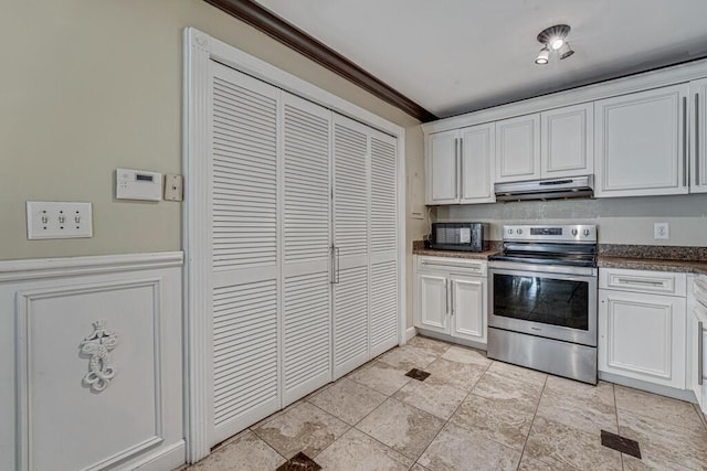 kitchen with crown molding, stainless steel electric range oven, and white cabinets