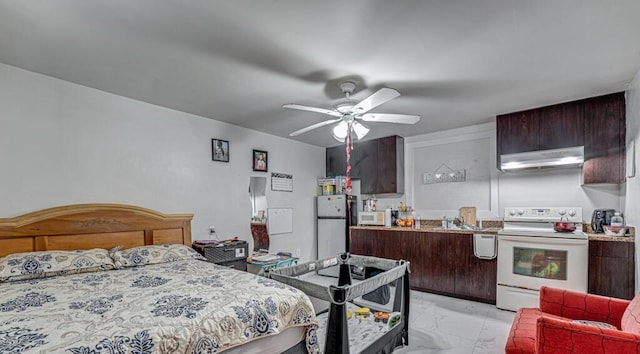 bedroom featuring ceiling fan and refrigerator