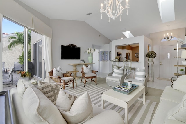 carpeted living room with a notable chandelier, high vaulted ceiling, and a skylight