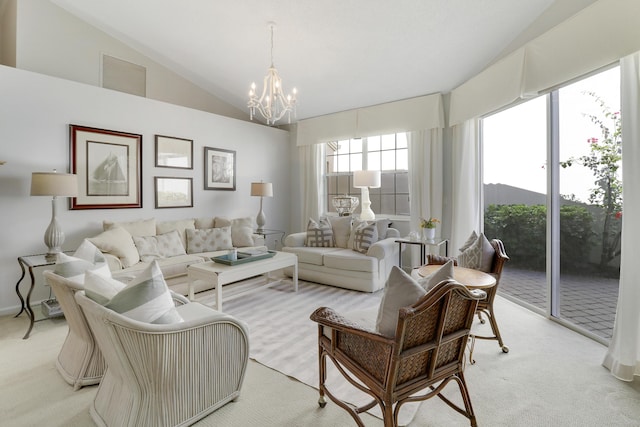 carpeted living room featuring an inviting chandelier and vaulted ceiling