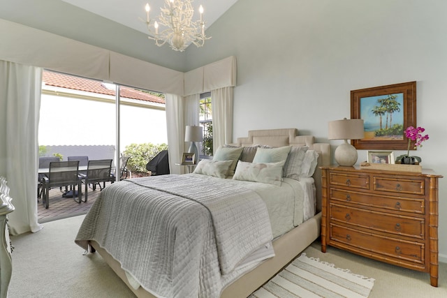 carpeted bedroom with lofted ceiling, access to outside, and a notable chandelier