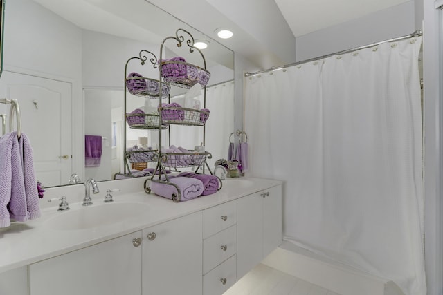 bathroom featuring tile patterned floors and vanity