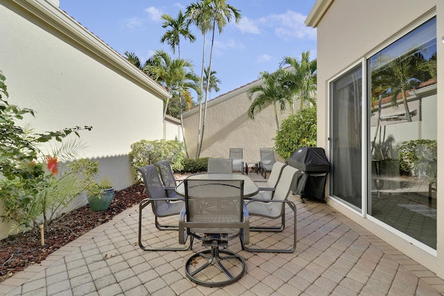 view of patio featuring a grill