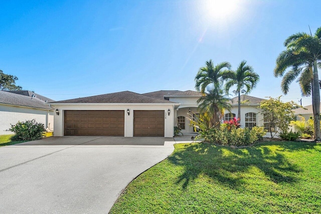 view of front of house with a garage and a front lawn