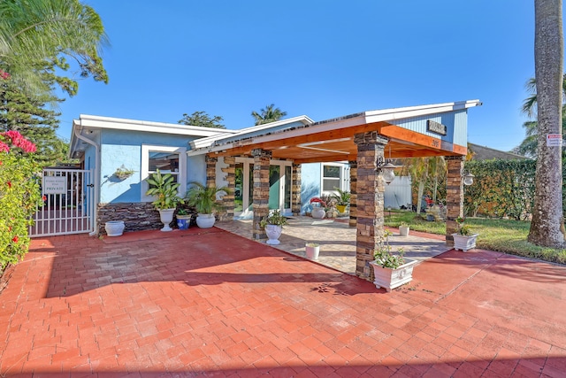 view of front of home with a patio area