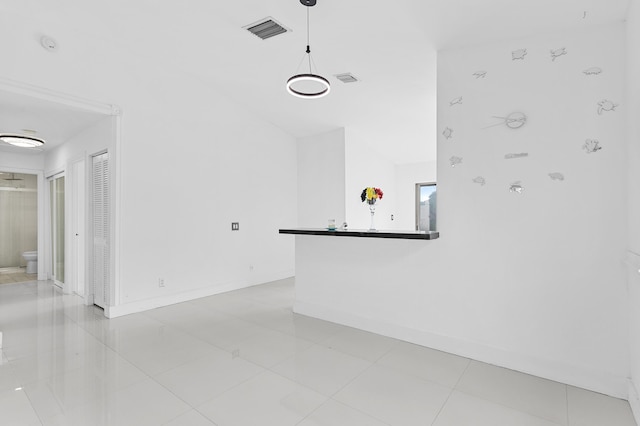 unfurnished living room featuring light tile patterned floors