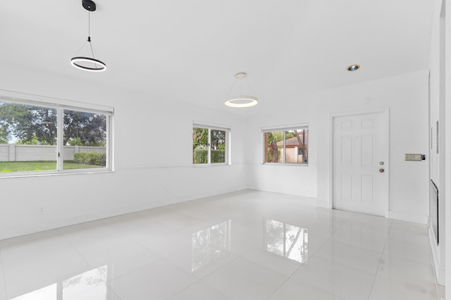 empty room with light tile patterned flooring