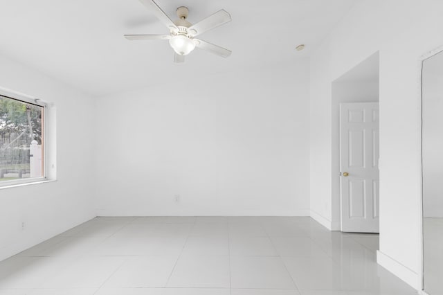 unfurnished room featuring ceiling fan