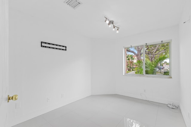 view of tiled spare room