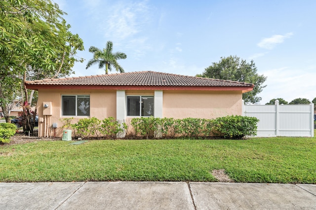 view of property exterior featuring a lawn