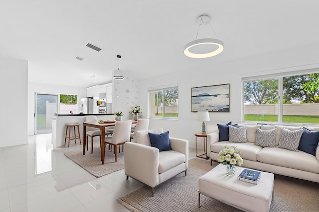 living room with light tile patterned floors