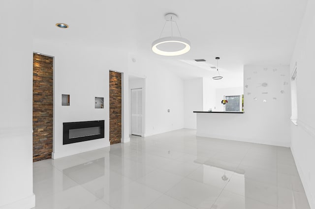 unfurnished living room featuring light tile patterned floors