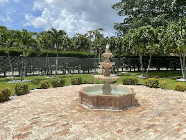 view of home's community featuring a yard and fence