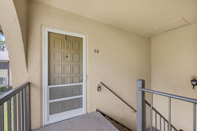 entrance to property with a balcony