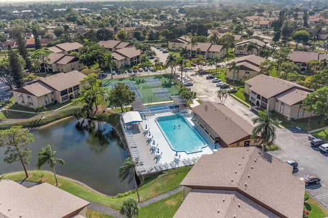 birds eye view of property with a water view