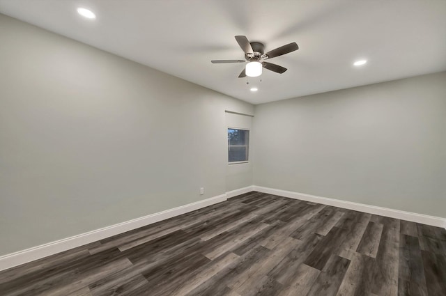 empty room featuring ceiling fan and dark hardwood / wood-style floors