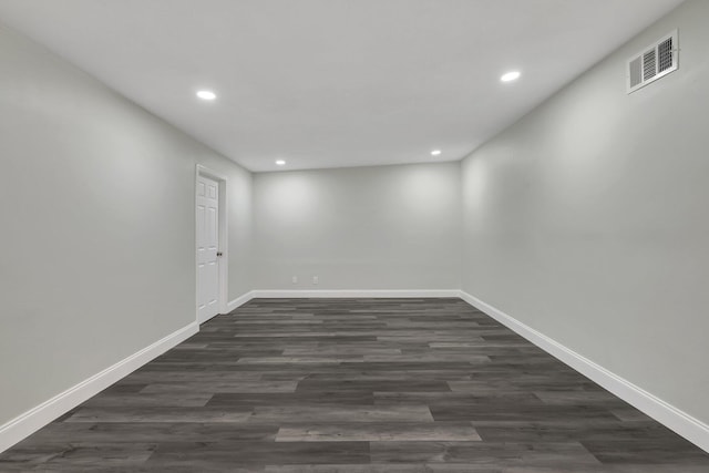 spare room featuring dark hardwood / wood-style floors