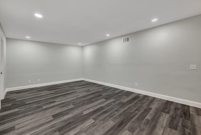 unfurnished room with dark hardwood / wood-style floors