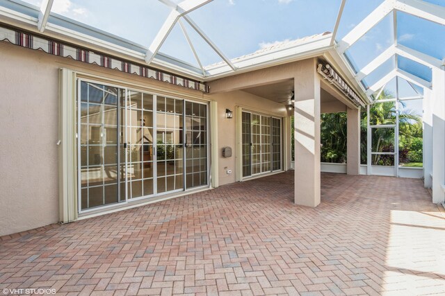 unfurnished sunroom with a skylight