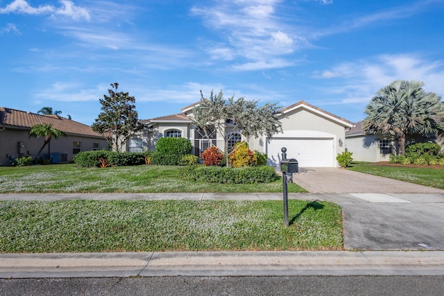 view of front facade with central AC, a front yard, and a garage