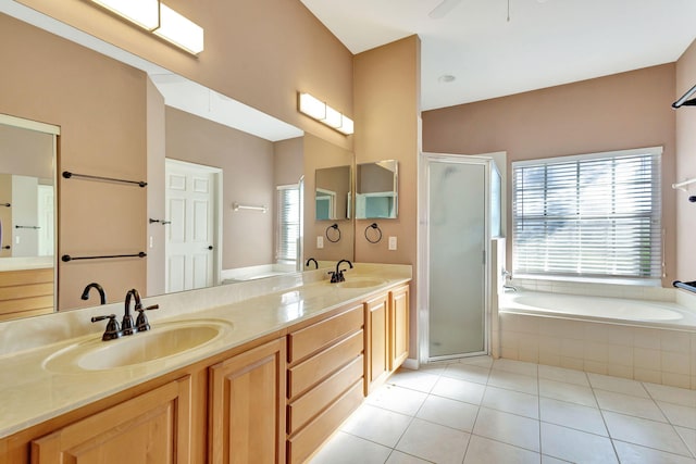 bathroom with shower with separate bathtub, tile patterned floors, and a healthy amount of sunlight