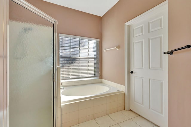 bathroom with tile patterned flooring and plus walk in shower