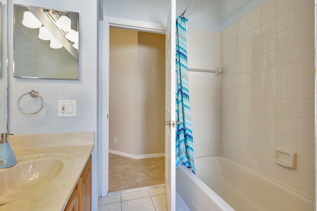 bathroom featuring tile patterned floors, shower / bath combo with shower curtain, and vanity