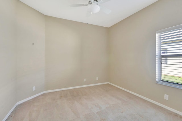 unfurnished room featuring ceiling fan and light colored carpet