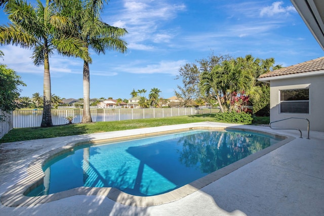 view of swimming pool featuring a water view